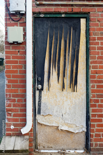 Extremely rundown deteriorated door