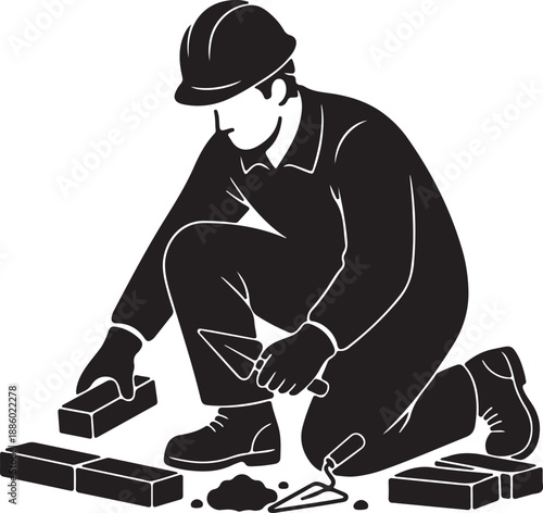 Black and white of a bricklayer working with bricks