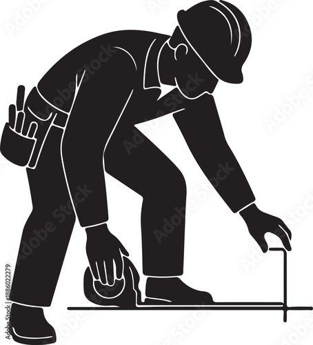 Black and white of a construction worker bending over