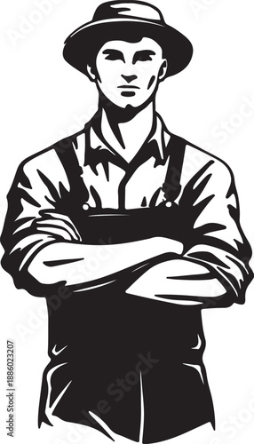 Man in overalls with arms crossed wearing a hat 1