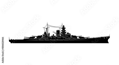 Silhouette of a powerful historical warship at sea.