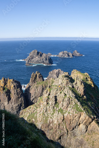 Cabo Ortegal lighthouse in Cariño, Galicia, Spain—where the Atlantic Ocean meets the Cantabrian Sea. Stunning cliffs and ancient rocks shape this wild coastal 
