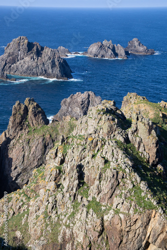 Cabo Ortegal lighthouse in Cariño, Galicia, Spain—where the Atlantic Ocean meets the Cantabrian Sea. Stunning cliffs and ancient rocks shape this wild coastal 