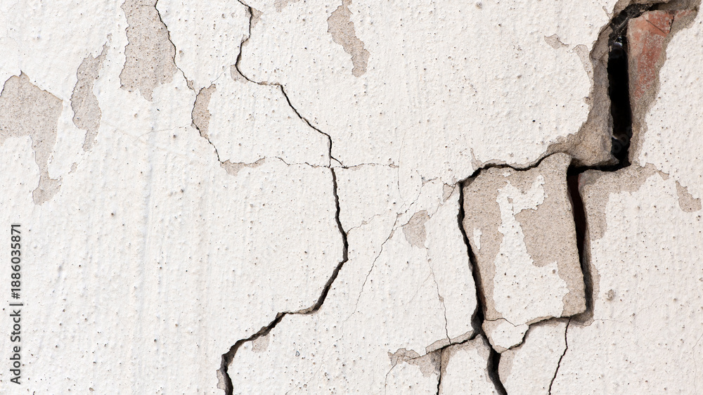 Fototapeta premium old plaster on the wall, adhesive for screed. wall is crumbling. surface for vintage background. Wall texture, cracked plaster, cement and brick wall, needs repair, restoration. space for text