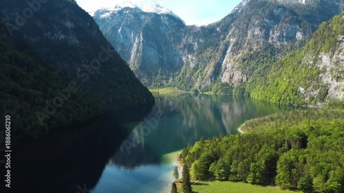 Wide aerial panorama of Lake Königssee surrounded by teep mountain slopes