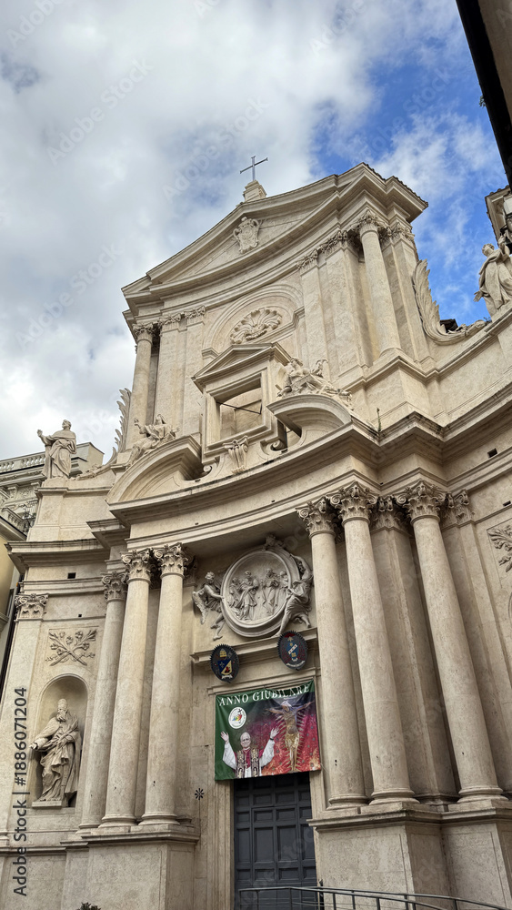 Fototapeta premium Baroque Facade of San Marcello al Corso Church in Rome with Sculptures. Italy