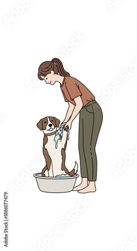 Woman washing dog in basin while standing indoors  