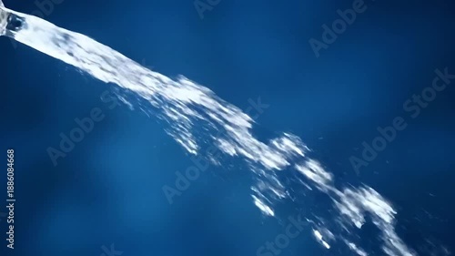 Crystal clear water stream flowing diagonally against a deep blue background