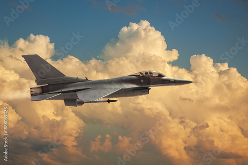 F-16 Flying Falcon jet model flies among dramatic clouds on a sunny day