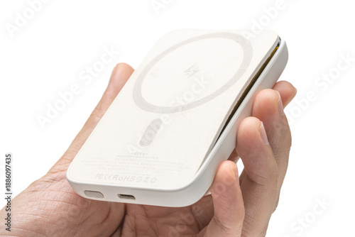Φωτογραφία hand holding swollen powerbank or battery pack