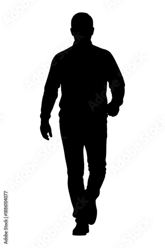 Silhouette of man walking towards camera