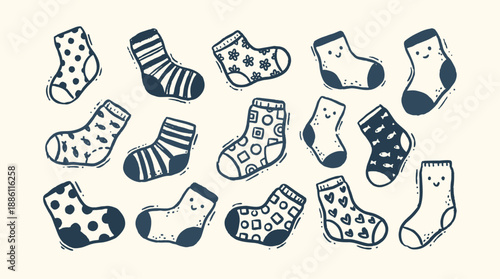 Whimsical kids doodle assortment of navy patterned baby socks scattered flat lay with smiling faces and hand drawn playful outline