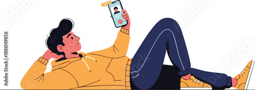 A young man lying on the floor, holding a smartphone, wearing casual clothes, in a relaxed pose, viewed from the side.