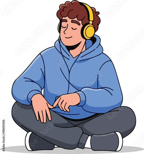 A young man meditating with headphones on in a relaxed sitting position