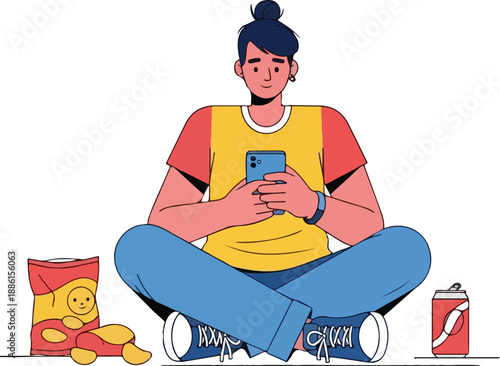 Man sitting cross-legged on floor using smartphone with snacks nearby