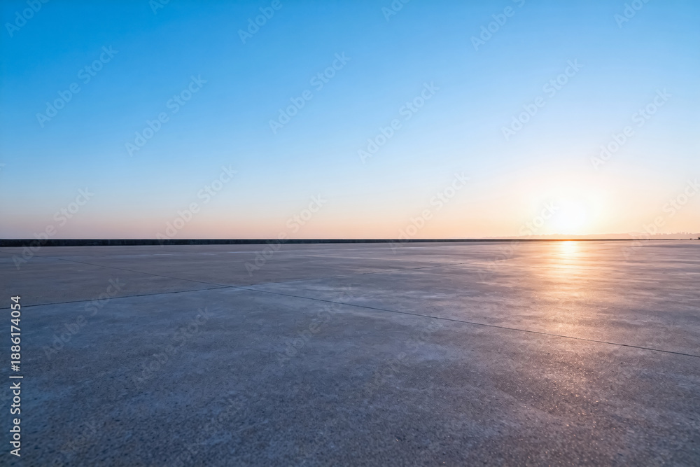 Fototapeta premium Sunset Over Vast Salt Flat with Clear Blue Sky