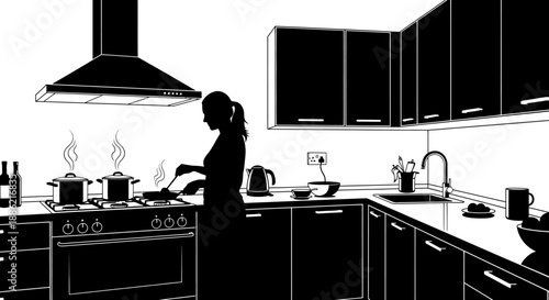 Silhouette of a woman cooking in a modern kitchen.