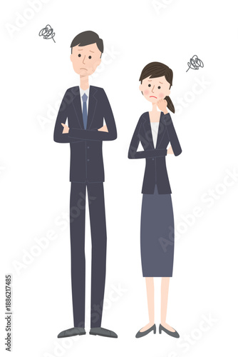 悩んでいるスーツ姿の若い男女