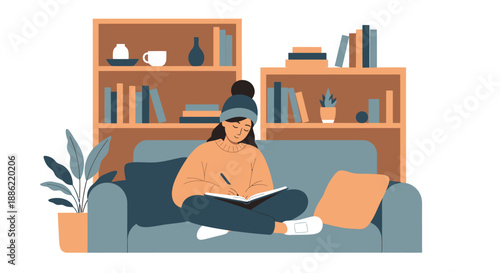 Young woman in beanie writing in notebook on sofa.