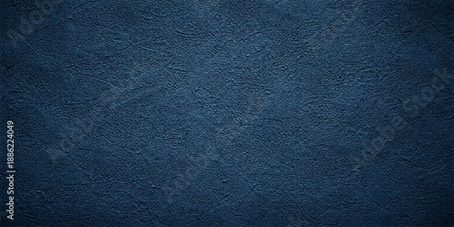 Dark blue textured leather and fabric material background with a macro denim pattern on a rough grunge surface design