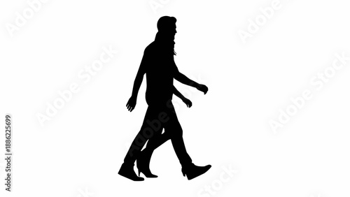 Silhouette of two people walking side by side.