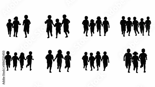 Silhouettes of children running together in a group.