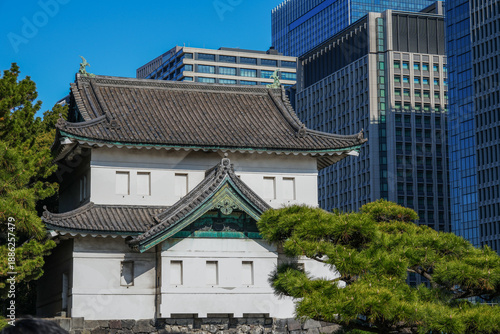 Wallpaper Mural A close-up of a historic building in the Imperial Palace gardens against a backdrop of modern buildings. Torontodigital.ca