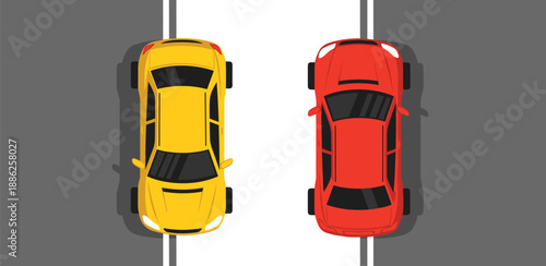 Two cars facing opposite directions on a road viewed from above