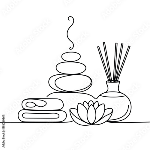 Serene spa setting with stones and aromatic diffuser