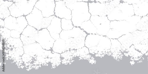 An ancient weathered concrete surface features a dirty grunge wall texture with a cracked paint pattern and peeling aged plaster for a vintage design