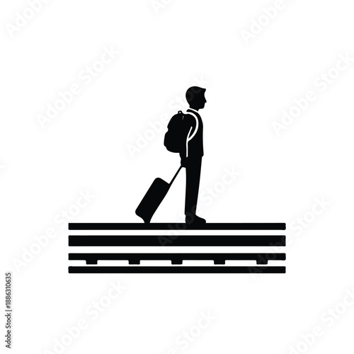 Man with luggage standing on a platform, possibly at a train station