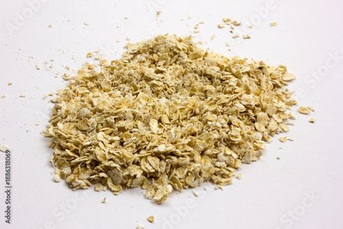 Pile of oatmeal isolated on white background. Eating oatmeal regularly should benefit your health, it can increase your fiber intake, help manage blood sugar and cholesterol levels, and potentially lo