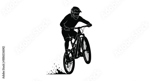 Silhouette of a motocross rider performing a jump on a mountain bike