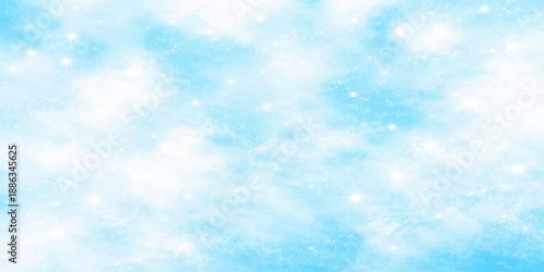 An abstract blue Christmas bokeh background featuring fluffy white clouds in a bright sunny sky for a beautiful high atmosphere nature cloudscape