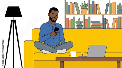 Happy man using smartphone while sitting on yellow sofa at home