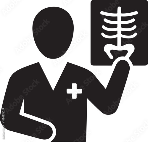 Medical professional holding up a spine xray image for examination