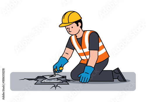 A construction worker in a safety vest and hard hat kneels to repair a crack in the concrete floor with a trowel and cement