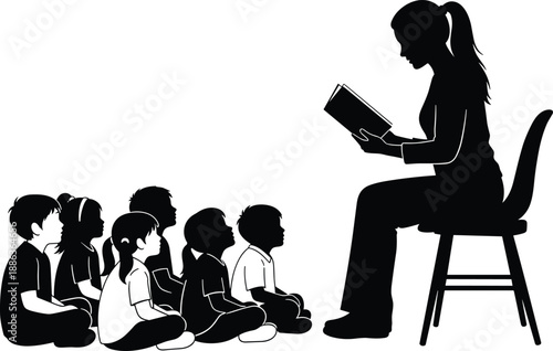 Silhouette of a female teacher reading a book to a group of young children, concept for storytelling, early childhood education and literacy