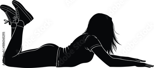 Silhouette of a young woman lying on her stomach with legs up, casual pose, female figure resting, isolated black on white background