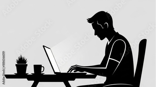 Silhouette of a man working on a laptop at a table.