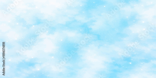 An abstract blue bokeh background merges with a beautiful clear summer sky filled with bright white fluffy clouds and sunlight for a high atmosphere nature cloudscape on a sunny day