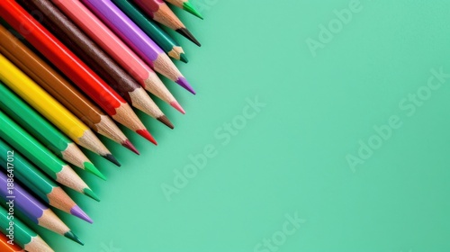 Colorful Wooden Pencils Arranged in a Row on a Vibrant Aqua Background Perfect for Creative Projects and Educational Materials