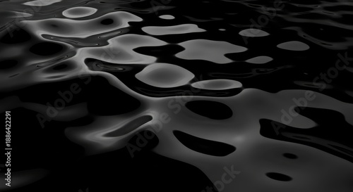 Abstract Water Surface with Light Reflections in Black and White.