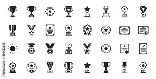 Assortment of trophies medals and certificates for achievement and winning awards