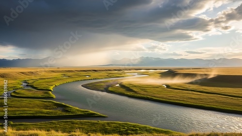 Wallpaper Mural Serene River Winding Through a Vast Grassy Landscape Under a Dramatic Sky. Torontodigital.ca
