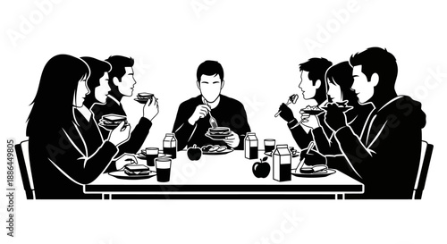 Group of people eating together at a long table.