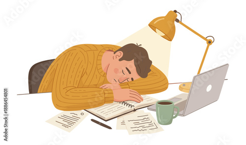 Man asleep at desk with open book and laptop
