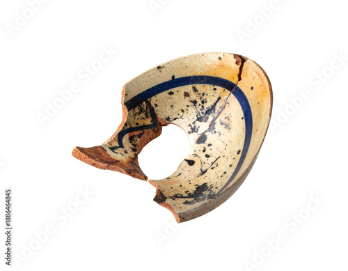 Antique, cracked ceramic bowl fragment, displaying intricate painted designs