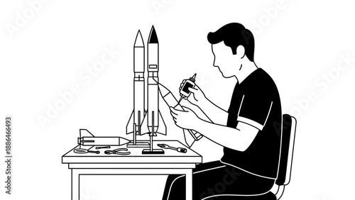 Man building model rockets on a table with tools.