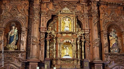 Main altarpiece of a Spanish Catholic church. Polychrome figures carved in wood. Catholic religious icons. Spanish Catholic religious art. Church of San Mateo. Cáceres. Spain.